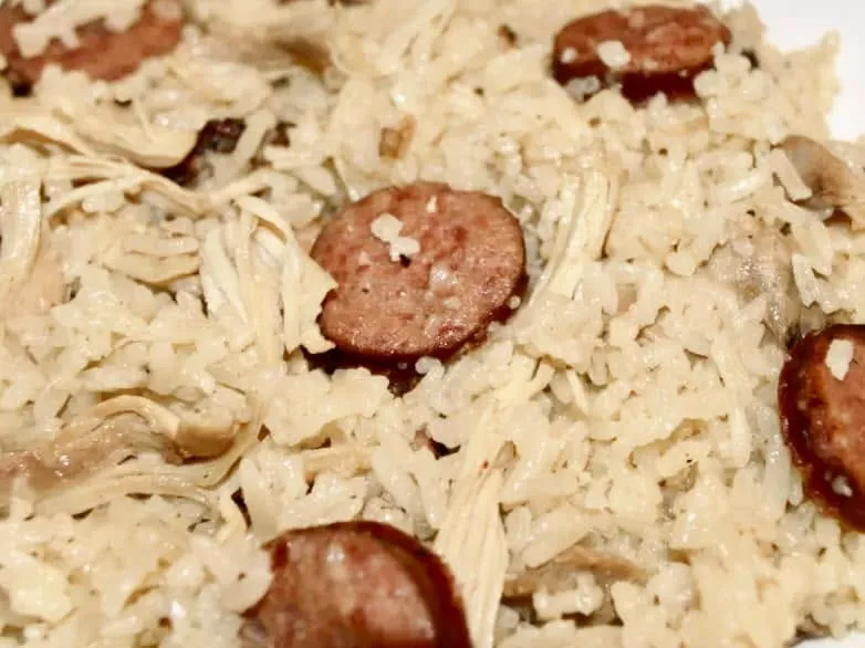 A plate of rice with smoked sausage straight from the kitchen